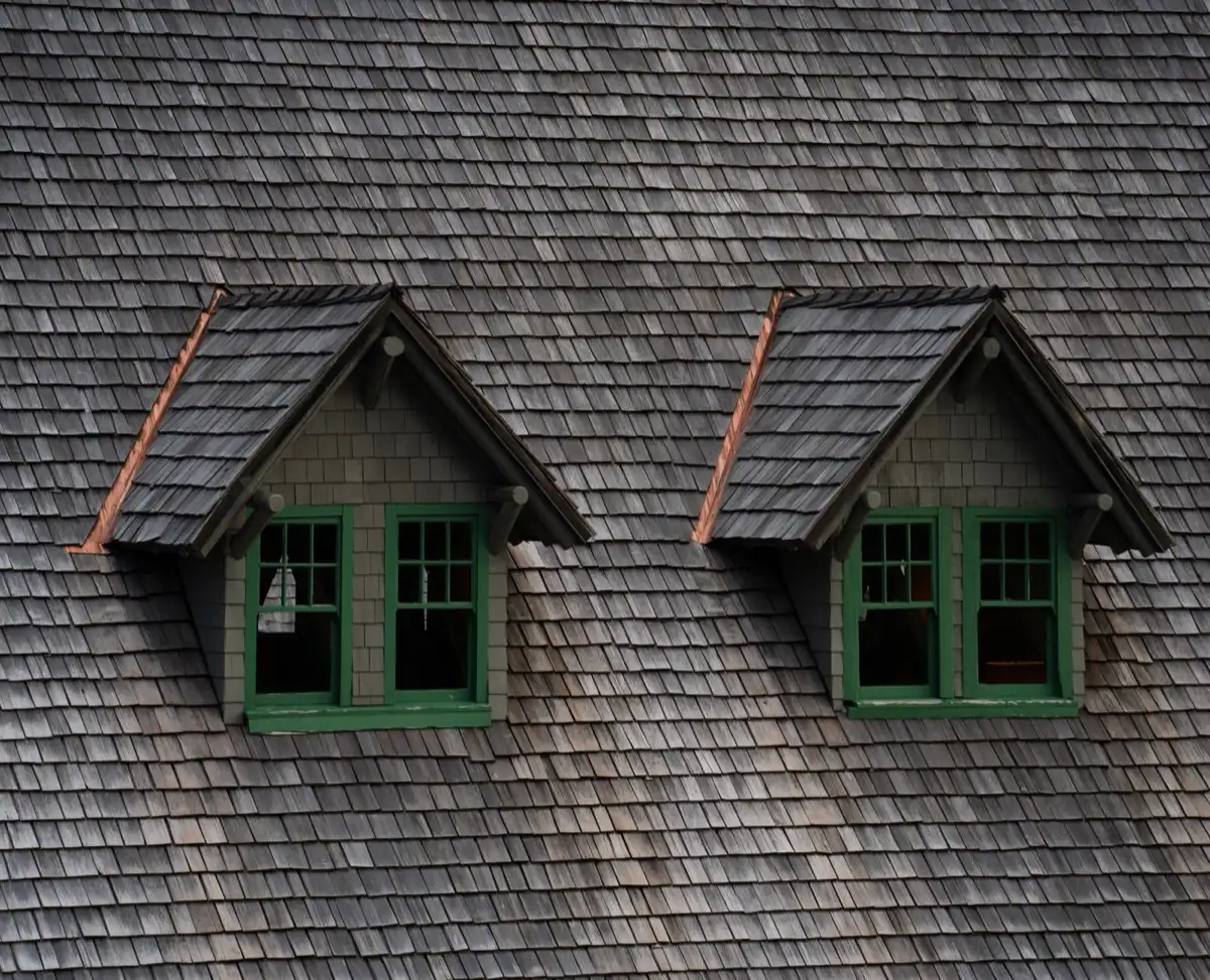 Dormers on a shingle roof in Brandon, FL, where step flashing and kickout flashing carry water past the walls